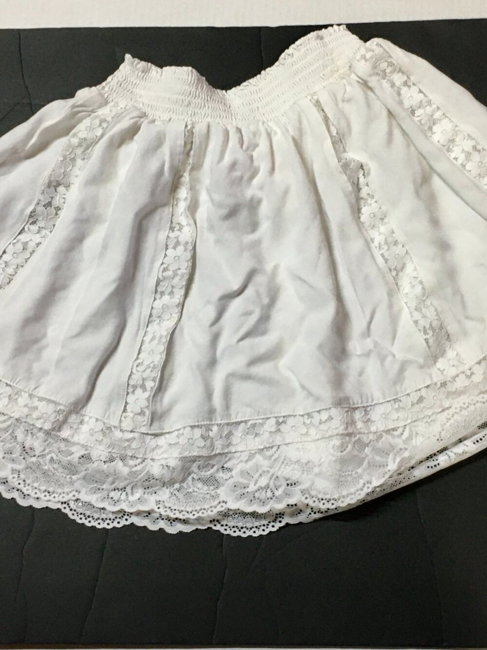 Pink Lily Women's White Smocked waisted Rayon Mini Skirt with Lace, Size XS